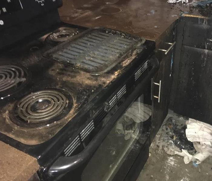 Dirty stove top and oven. 